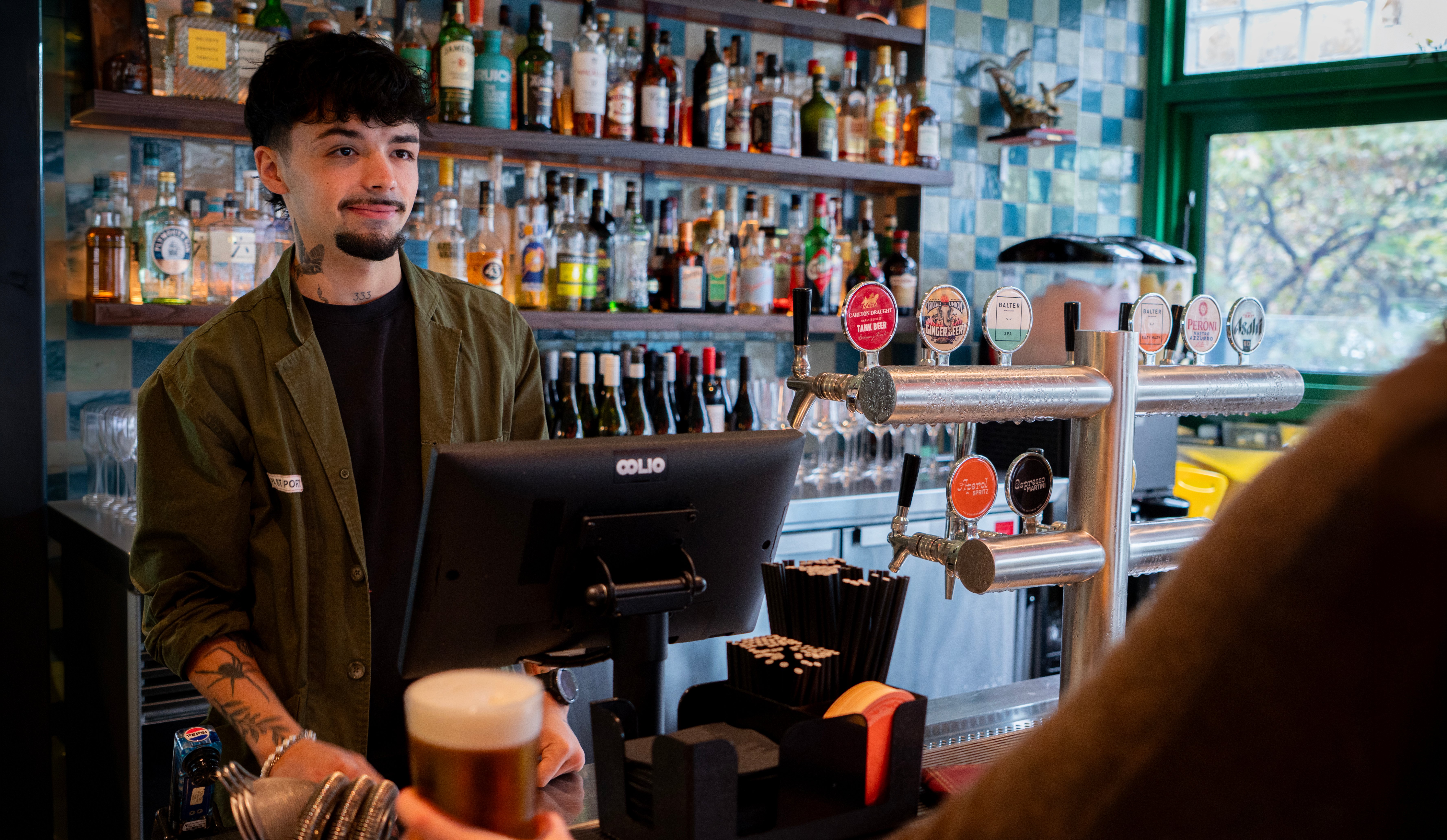 Bartender serving beer